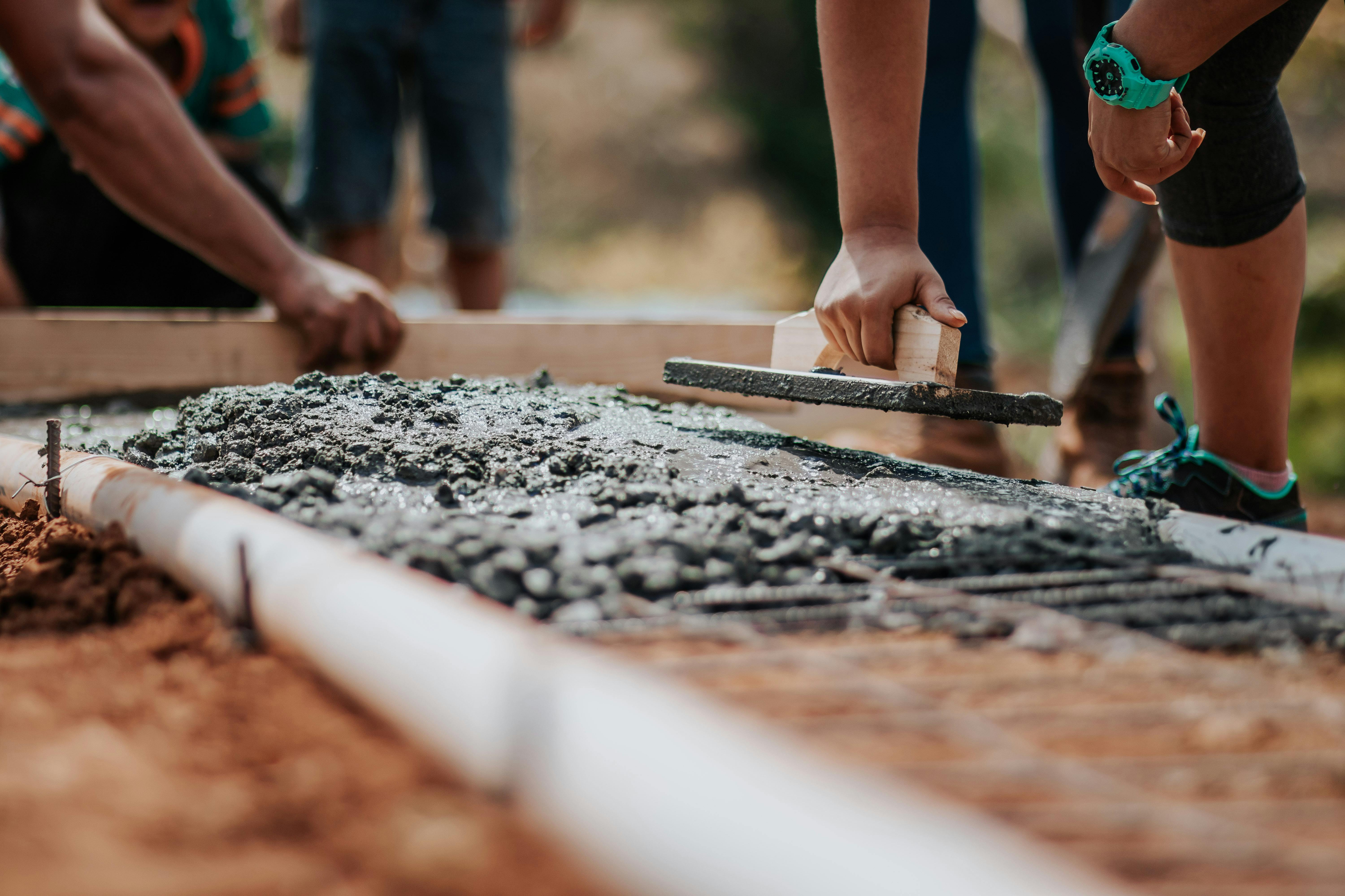 Construction team working with concrete on site