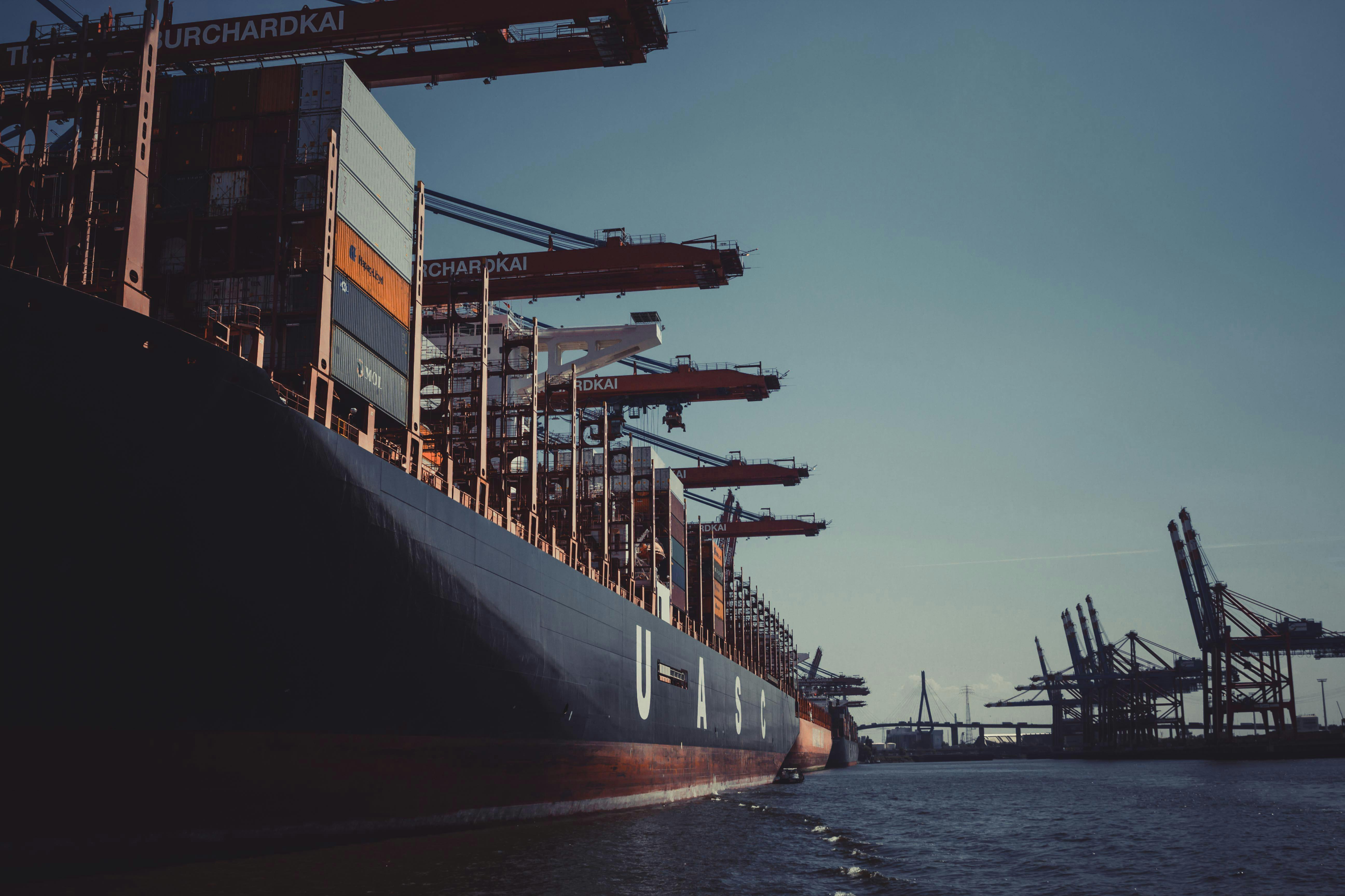 Industrial shipping containers and cranes at a port